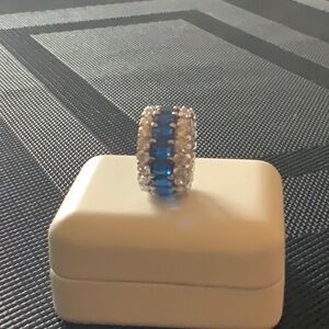 Beautiful sapphire and diamond eternity band simulated, diamonds, and stones.